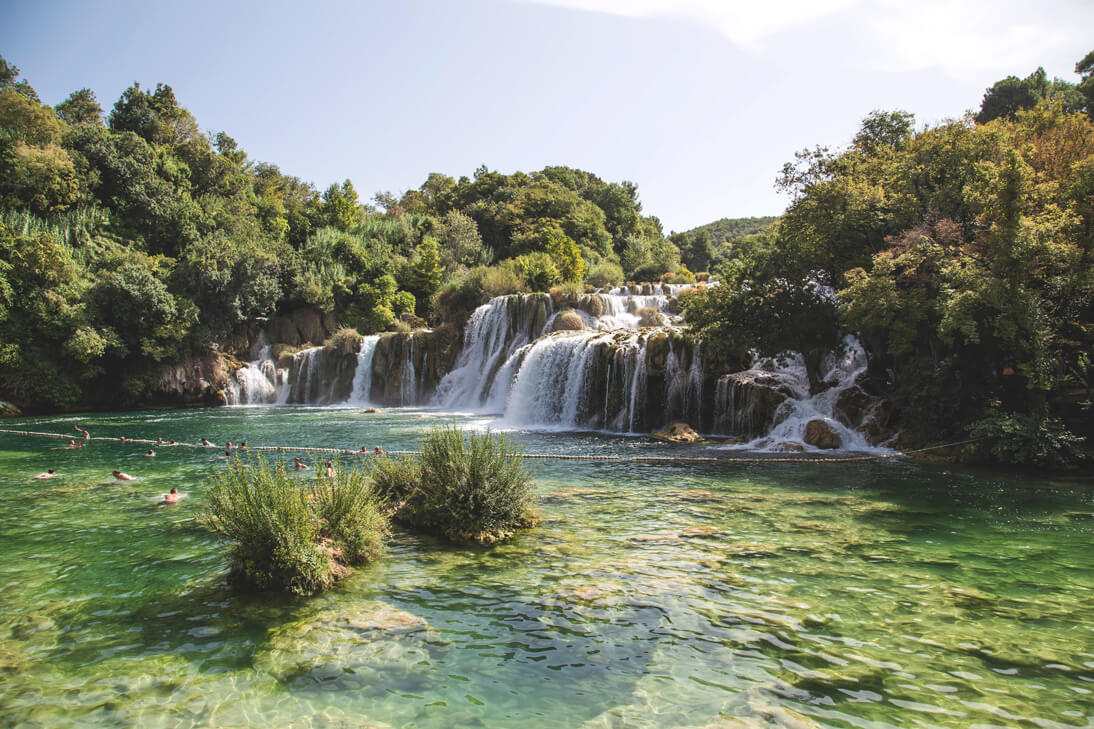 People swimming in Krka river