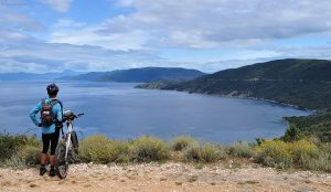 A person admiring the view of Vransko Jezero